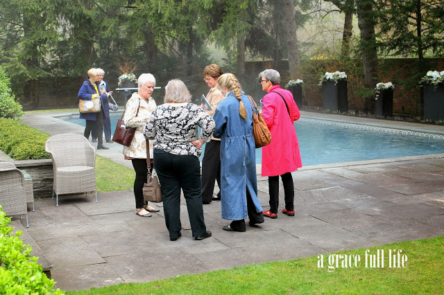 ladies chatting by John Hughes pool 