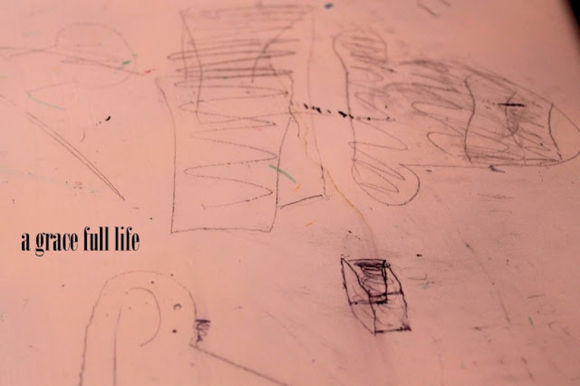 sketch marks on desk